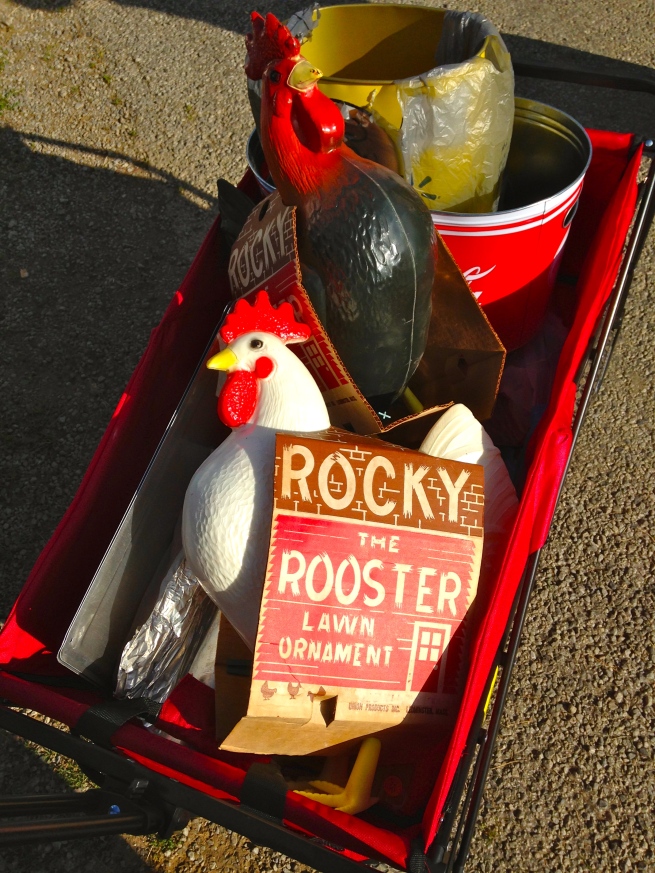 Two plastic Rocky-the-Roosters in my wagon! Ha!